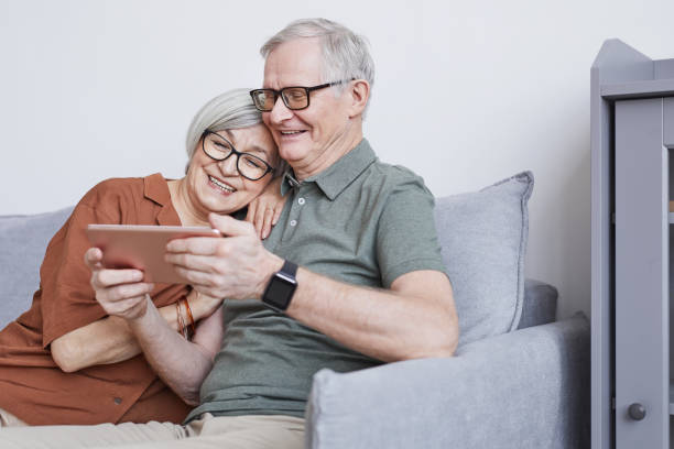 istock Senior Couple Using Tablet at Home 1329844346