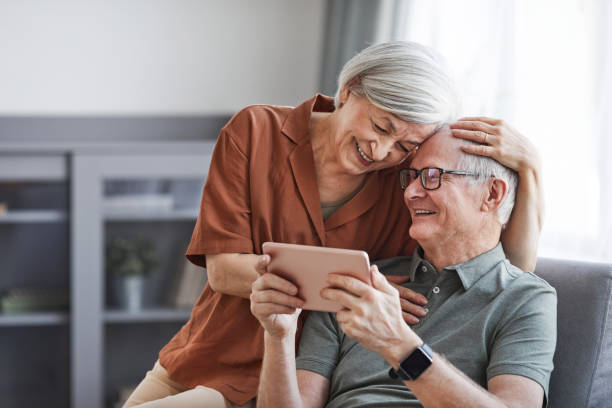 istock Carefree Senior Couple Using Tablet 1329844399