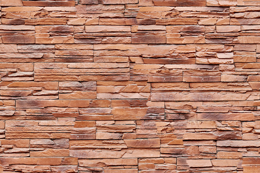 Closeup photo of modern brown brick wall background