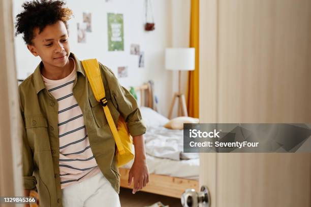 Boy Leaving For School Stock Photo - Download Image Now - Teenage Boys, Boys, Standing