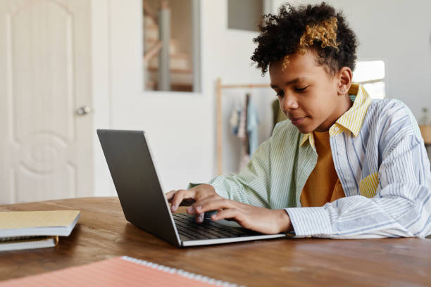 istock Teenage Boy Using Laptop 1329845680
