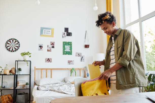 istock Teenage Boy Packing for School 1329845730