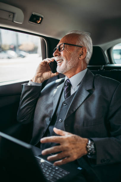 istock Senior business man in car 1329847024
