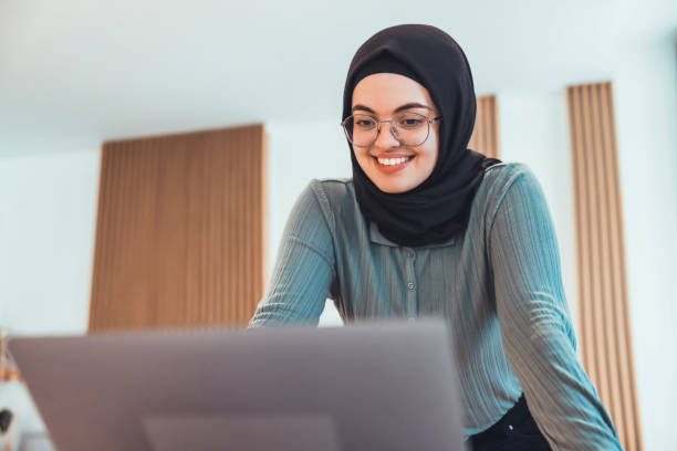Young Woman doing a Video Conferencing using his laptop