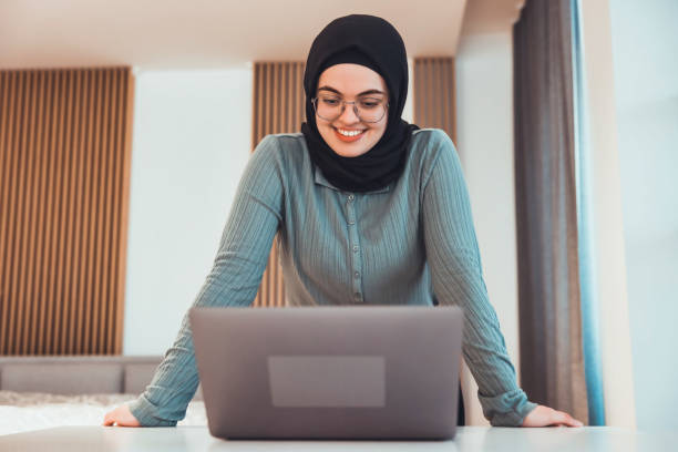 istock Young Woman doing a Video Conferencing using his laptop 1329847980