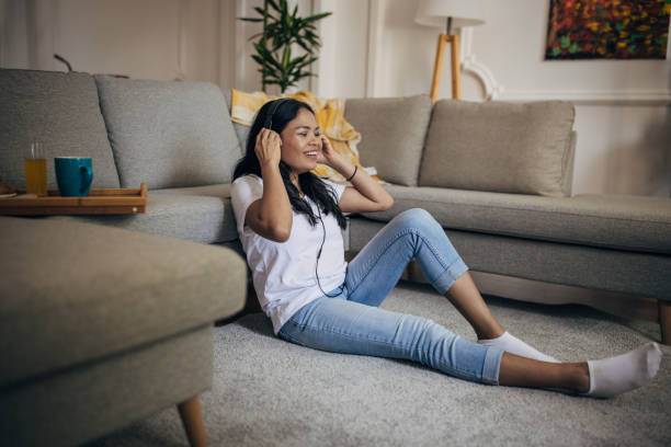 istock Woman relaxing at home 1329850936