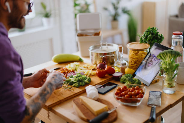 istock Young man on a video call with a friend 1329851021
