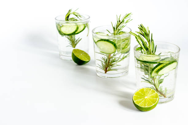 istock Cold fresh cocktail with lemon slices cucumber and rosemary 1329852795