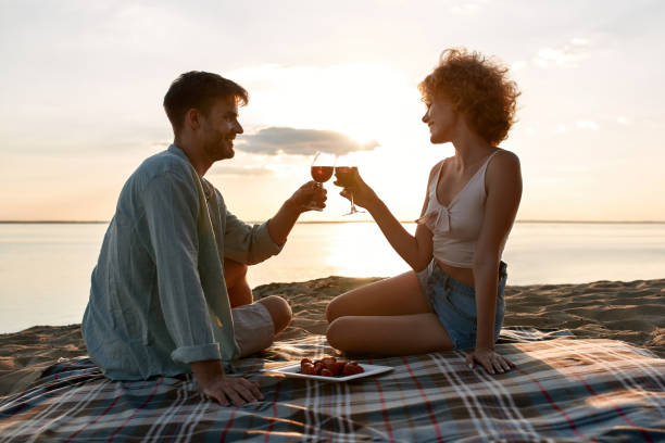 istock Smiling young caucasian couple drinking red wine 1329853587