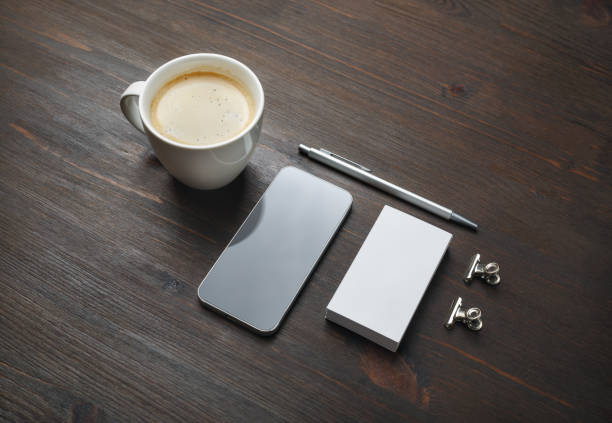istock Smartphone, coffee, business card, pen 1329854119