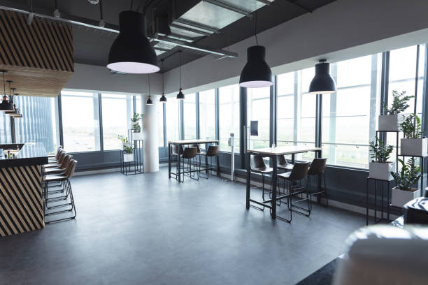 istock Interior of empty cafeteria with tables in modern office 1329854397