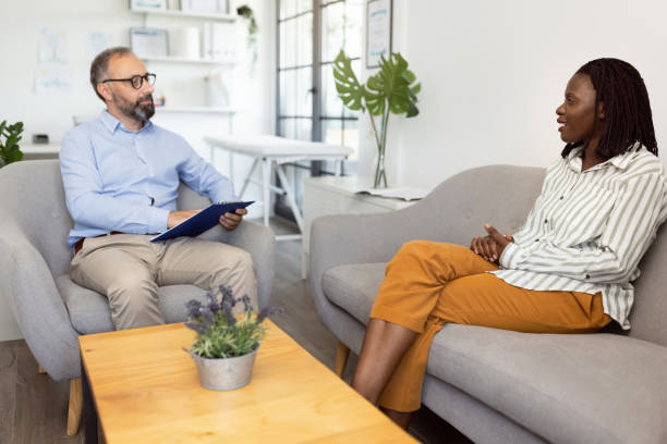 istock Mother talking with a male psychologist about her daughter´s problems 1329854575