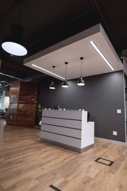 istock Interior of empty lobby with reception counter in modern office 1329855281