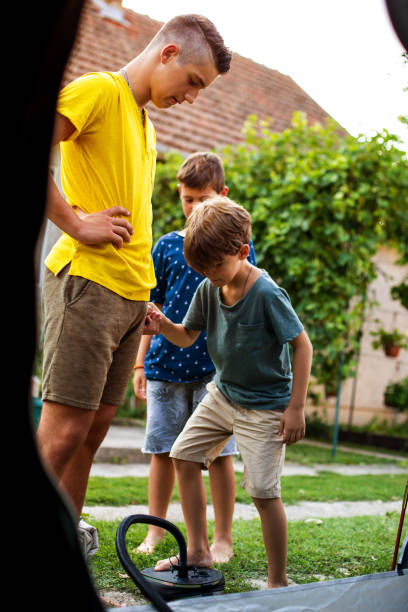istock Little boy is blowing mattress. 1329855690