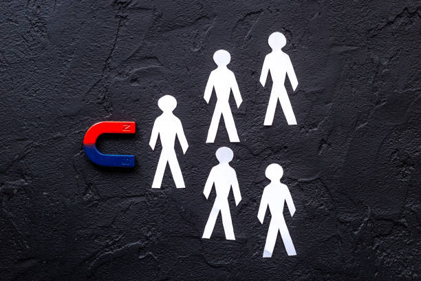 istock Recruiting concept with magnet collecting human figures. Top view 1329856998