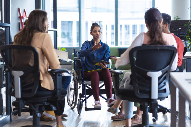 istock Diverse group of creative colleagues talking at casual meeting 1329858215