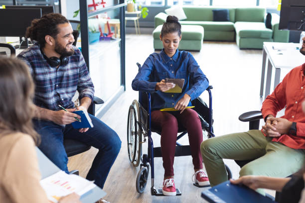 istock Diverse group of creative colleagues talking at casual meeting 1329858374