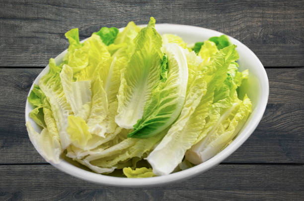istock Cabbage. Peking cabbage leaves on a white plate. 1329859217