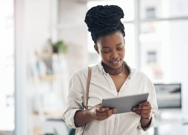istock Shot of a businesswoman using her digital tablet at work 1329859584