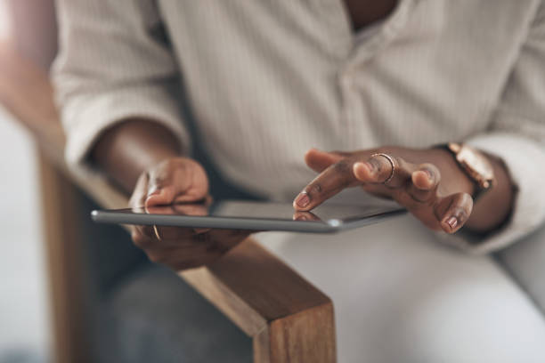 istock Shot of a businesswoman using her digital tablet at work 1329859908