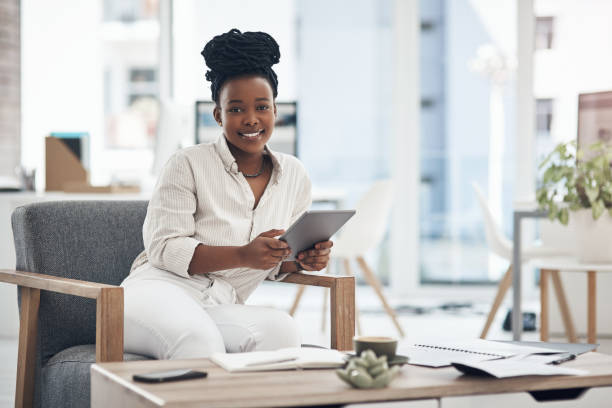 istock Shot of a businesswoman using her digital tablet at work 1329859910