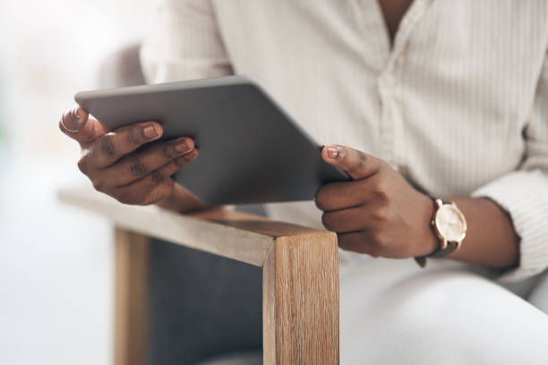 istock Shot of a businesswoman using her digital tablet at work 1329859913