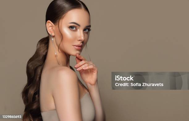 Portrait Of Perfectly Looking Young Brown Haired Woman With Long Hair Wearing In Exquisite Makeup Hairstyle And Makeup Stock Photo - Download Image Now