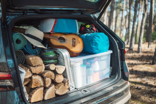 istock Full car trunk with camping equipment 1329866433