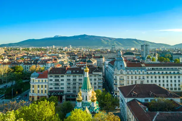 Photo of Drone shot of the russian church, officially known as the Church of St Nicholas the Miracle-Maker and Vitosha mountain in Sofia, Bulgaria (Bulgarian: Руската църква Свети Николай Чудотворец и планина Витоша 