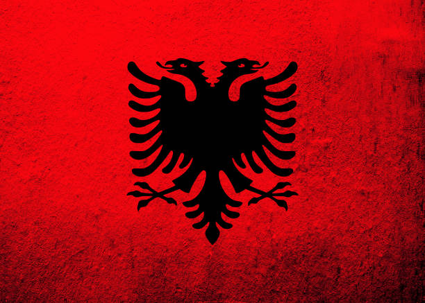 istock Republic of Albania National flag. Grunge background 1329867993