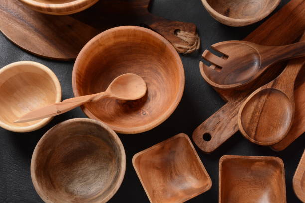 istock Culinary background, empty ceramic plates, wooden or bamboo spoons and bowls 1329868368