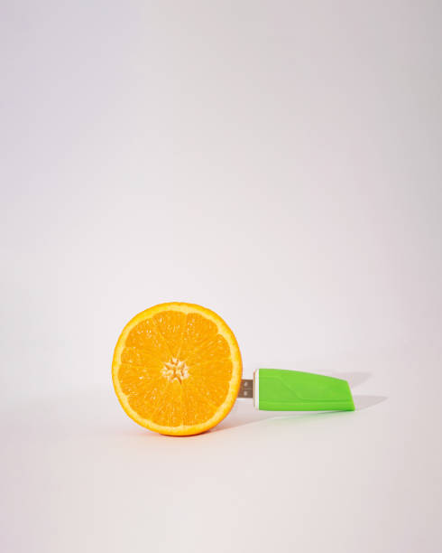 istock memory flash in a slice og orange.summer tehnology concept 1329868973