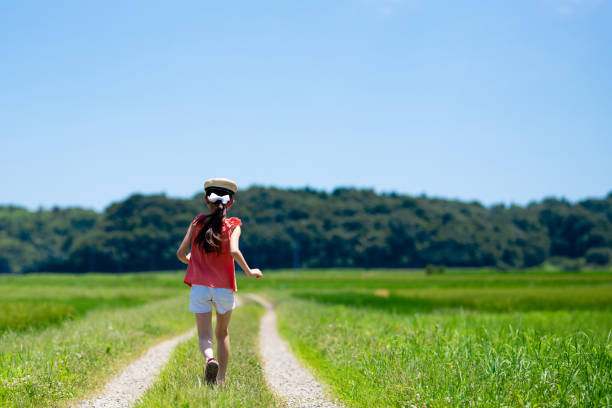 istock A child walking on a summer road 1329870702