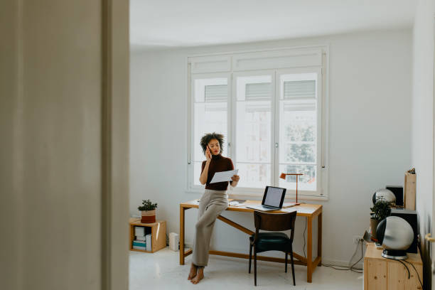 istock Young Successful Afro Woman Analyzing Data in her Home Office 1329870948