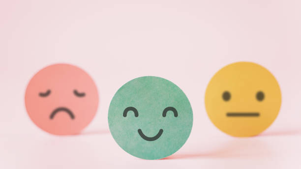 istock outstanding smiling face on green paper with speech bubble on pink background, satisfaction survey ,good feedback rating and positive customer review, mental health assessment, leadership 1329871928