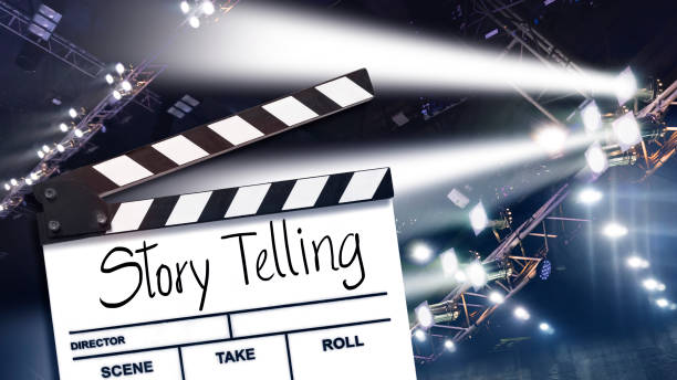 istock storytelling.Text title on film slate and stage lighting in backgrounds 1329873263