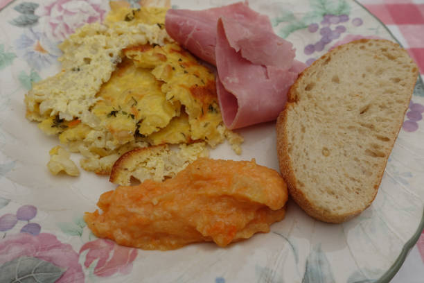istock White ham served with pasta gratin and mashed potatoes and sweet potatoes  Meal served 1329873816