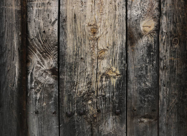 istock ancient, weathered and worn surface of dark wood from an old door or table - rough texture background 1329874708