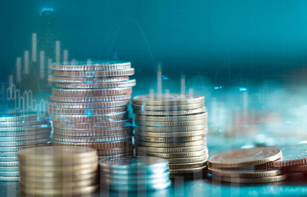 istock Double exposure of stack rows money coin with trading graph chart stock market. Value exchange and marketing of bank fund economic profit with growth. Finance investment and business concept. 1329876306