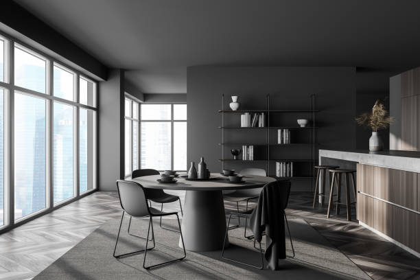istock Dark grey and wooden kitchen interior with bar and round table 1329877714
