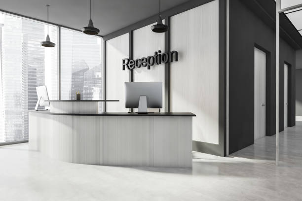 istock Business reception room interior with desk and windows with city view 1329879181