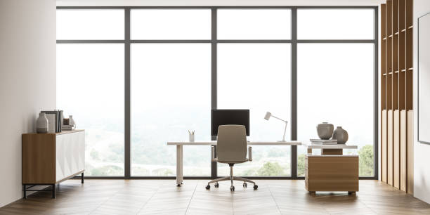 istock Panoramic front view of beige office with sideboard, desk and bookshelf 1329879502