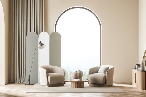 istock Light living room interior with two armchairs near arched window 1329879716