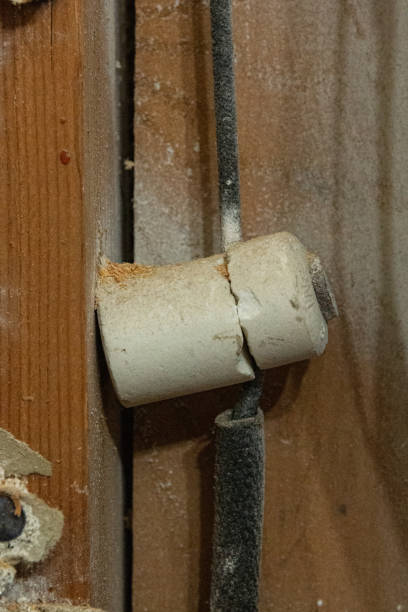 Old fashioned wiring known as knob and tube. Porcelain knob and wires in a tube.