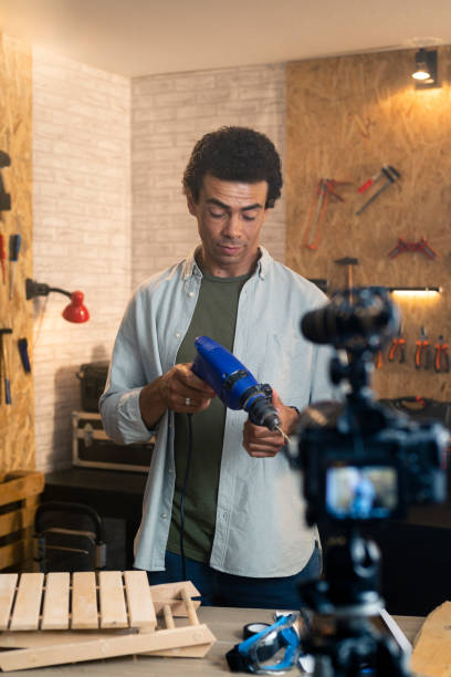 istock DIY carpenter filming a blog about drill 1329880955