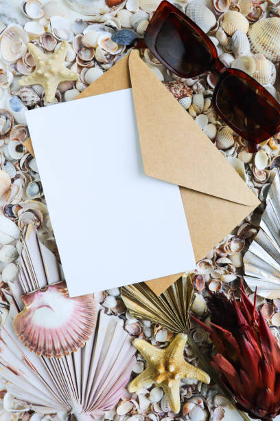 istock straw hat and sunglasses on seashells background 1329882220