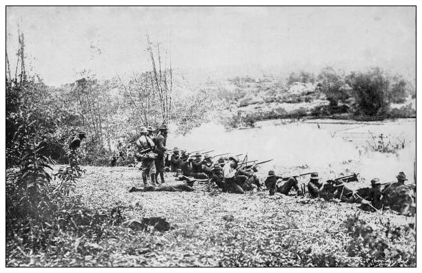 Antique black and white photograph: Firing line, Luzon, Philippines Antique black and white photograph of people from islands in the Caribbean and in the Pacific Ocean; Cuba, Hawaii, Philippines and others: Firing line, Luzon, Philippines firing squad stock illustrations
