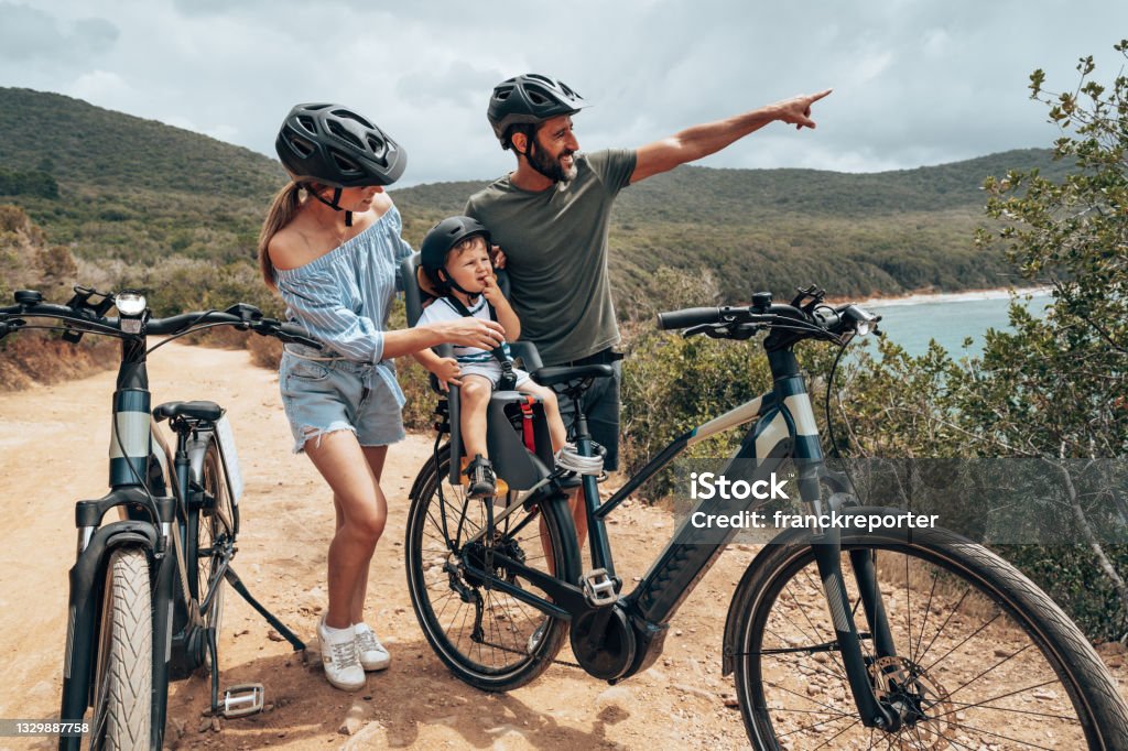 family with bike in a country tour Family Stock Photo