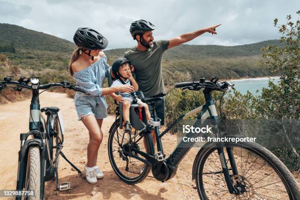 Family With Bike In A Country Tour Stock Photo - Download Image Now - Family, Cycling, Bicycle