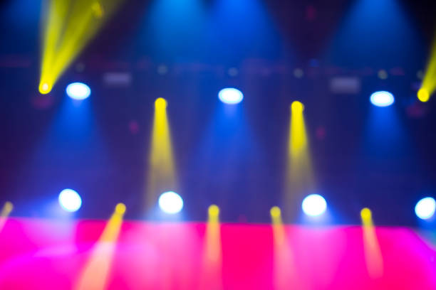 istock Bright blue background with a pink stripe and yellow beams from the projector. 1329887810